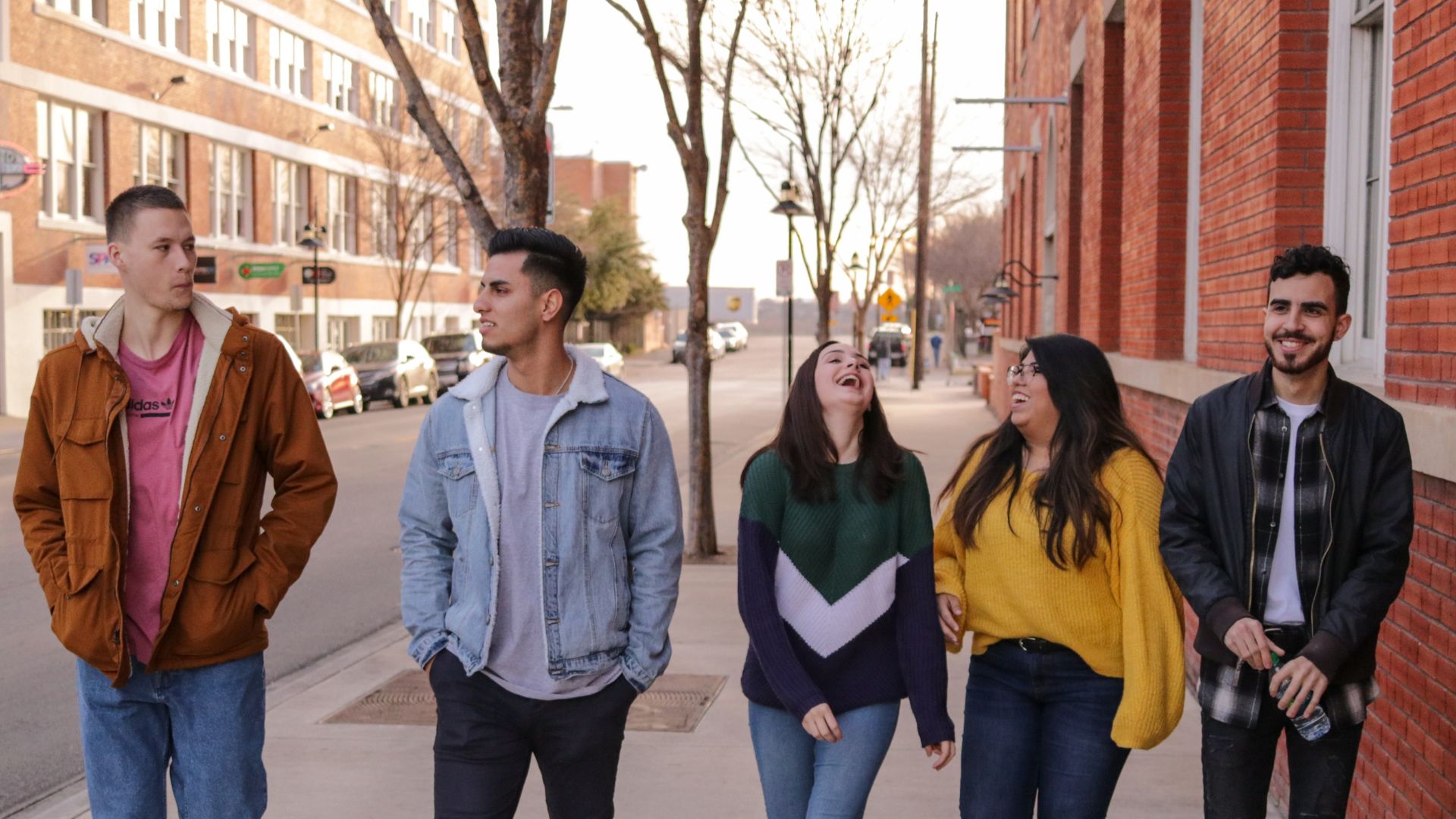 photo of happy group of students walking together