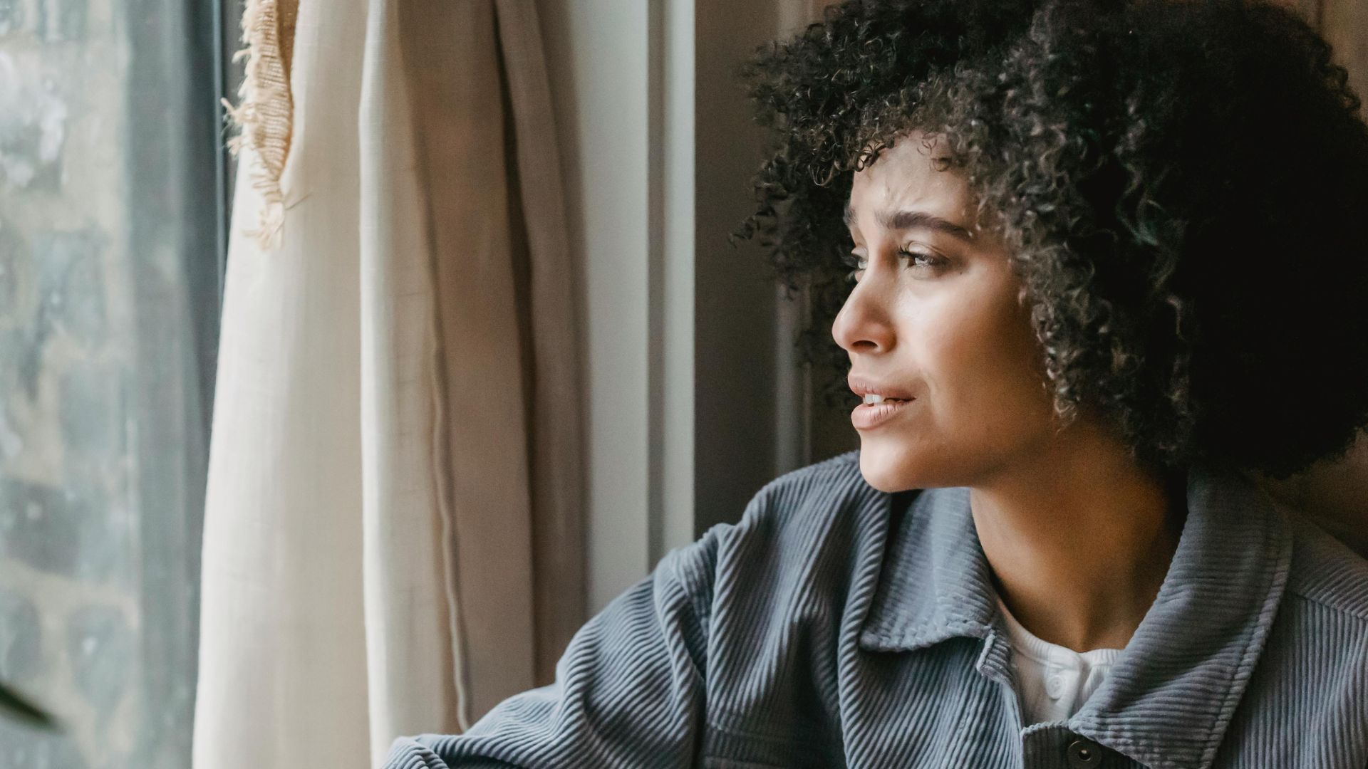 woman crying from depression sitting with box of tissues