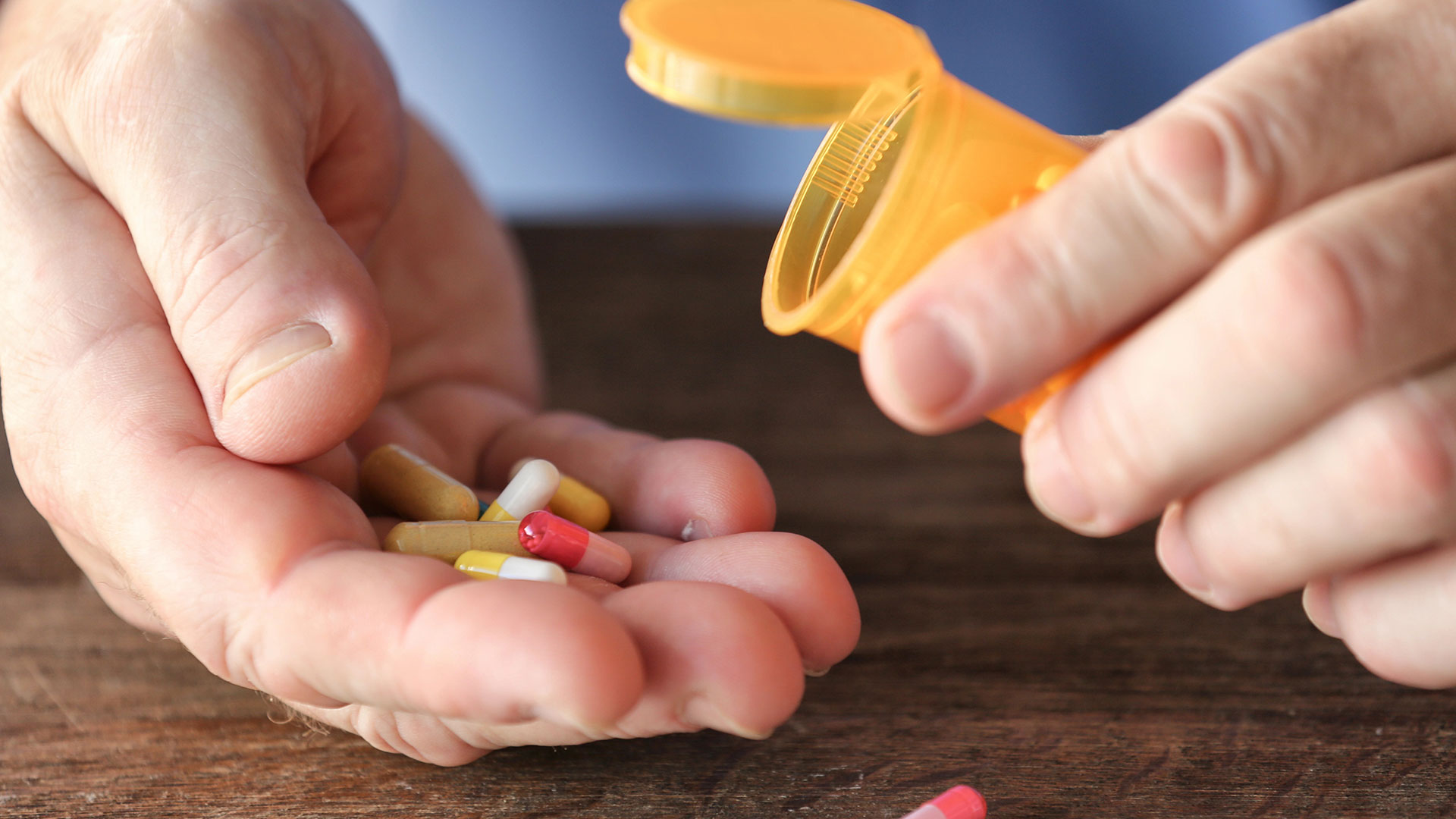 man holding pills