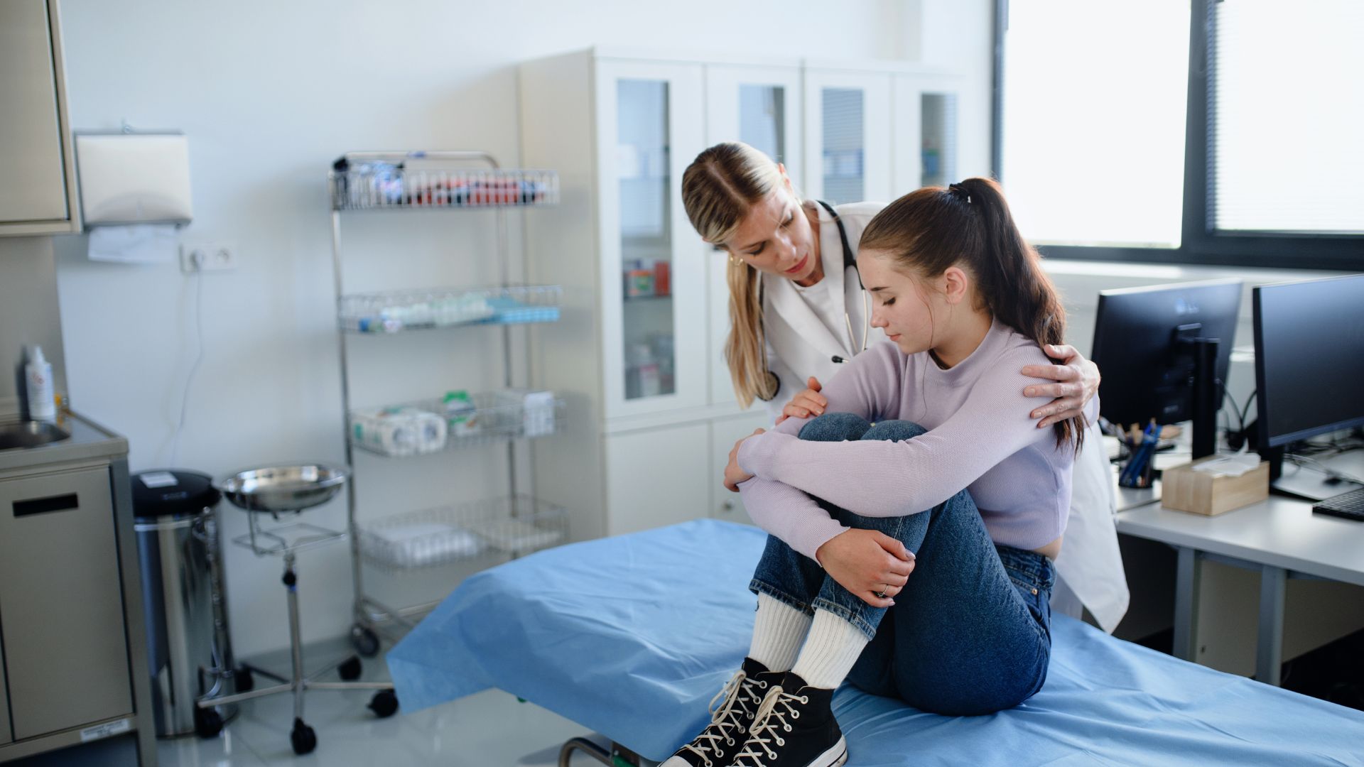 young woman talking to doctor