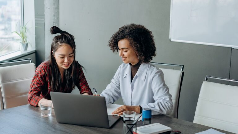 women collaborating in a modern office space