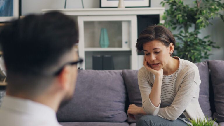 A therapist and client engaged in a counseling session