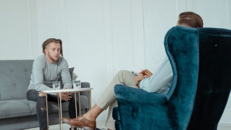 Two men engaged in a therapy session